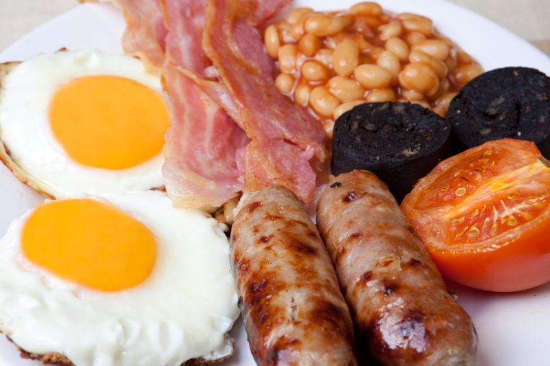 English breakfast: eggs, bacon and baked beans