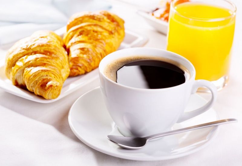 French breakfast: croissant, coffee and orange juice